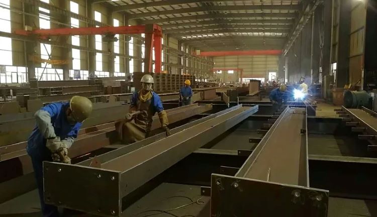 RAAF_Aircraft_Hangar_Steel_Structures_Australia_01_workshop-grinding