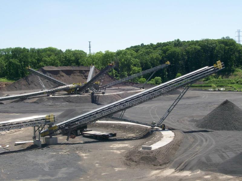 Screen Station Buildings and Screen Feed&Discharge Conveyors Steel Structures: Radial Stackers stacking multiple limestone products